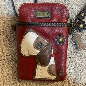 Crossbody leather small bag with dog design.